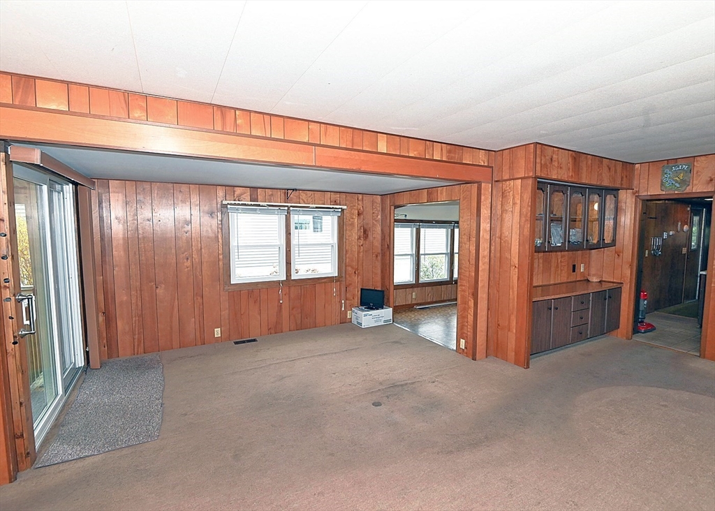 44 Great Hill Drive Wareham, MA 02576 - Photo 8 of 19 a view of an empty room with window and stairs