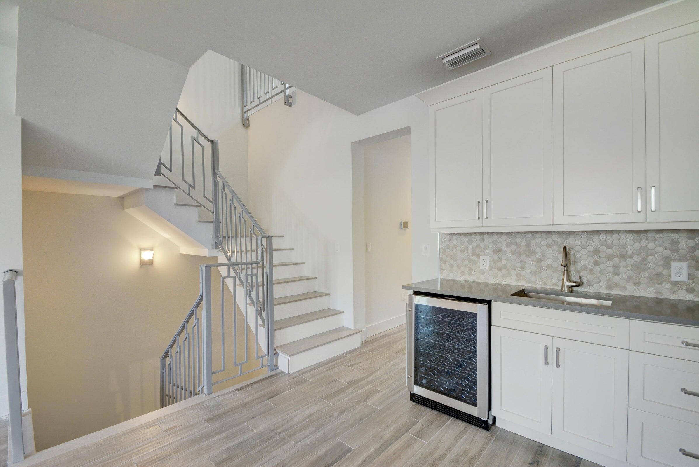 3770 County Line Road, Unit C2 Tequesta, FL 33469 - Photo 10 of 27 a kitchen with a sink and cabinets