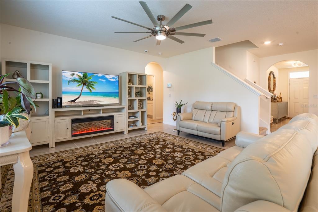 2540 Harmonia Hammock Road Harmony, FL 34773 - Photo 15 of 54 a living room with furniture and a flat screen tv