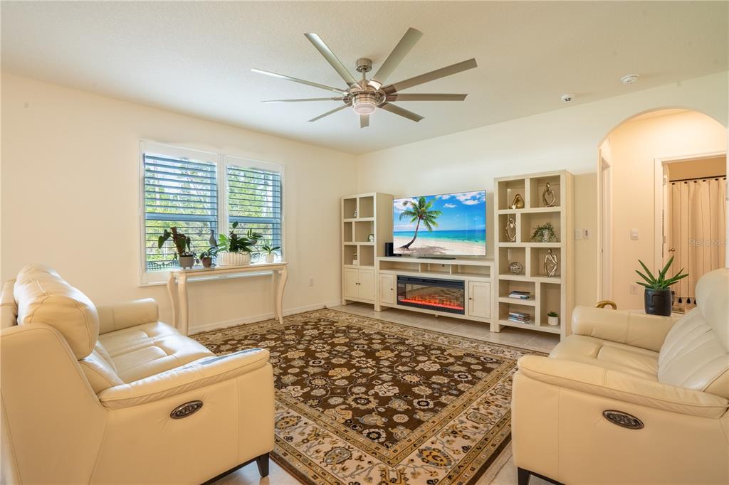 2540 Harmonia Hammock Road Harmony, FL 34773 - Photo 16 of 54 a living room with furniture and a table