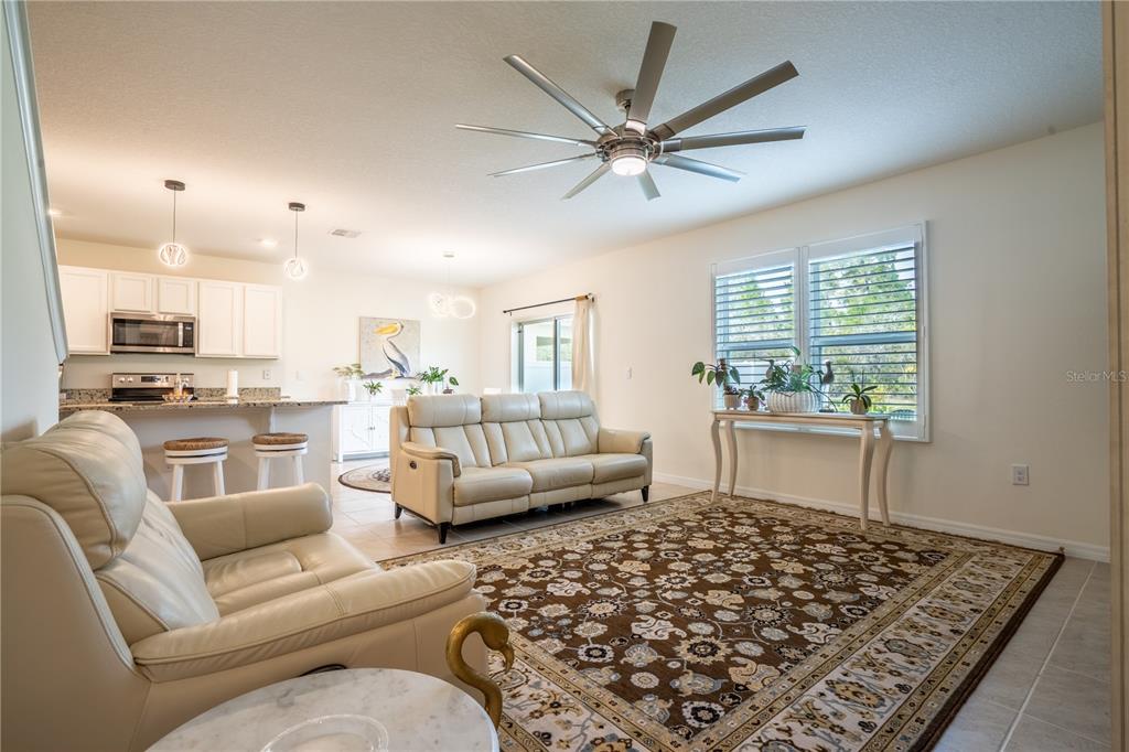 2540 Harmonia Hammock Road Harmony, FL 34773 - Photo 17 of 54 a living room with furniture and a window