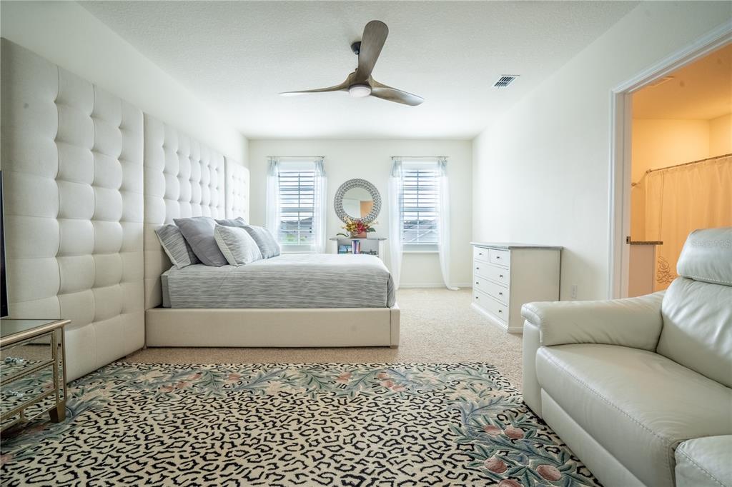 2540 Harmonia Hammock Road Harmony, FL 34773 - Photo 21 of 54 a living room with a couch and a window