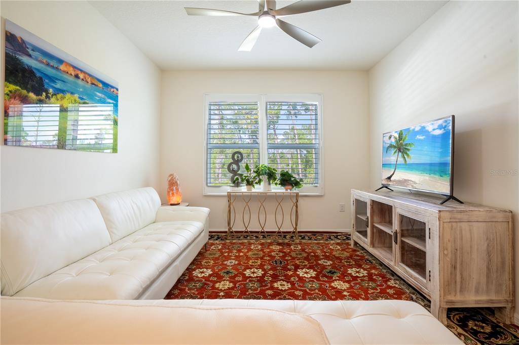2540 Harmonia Hammock Road Harmony, FL 34773 - Photo 27 of 54 a living room with furniture and a flat screen tv