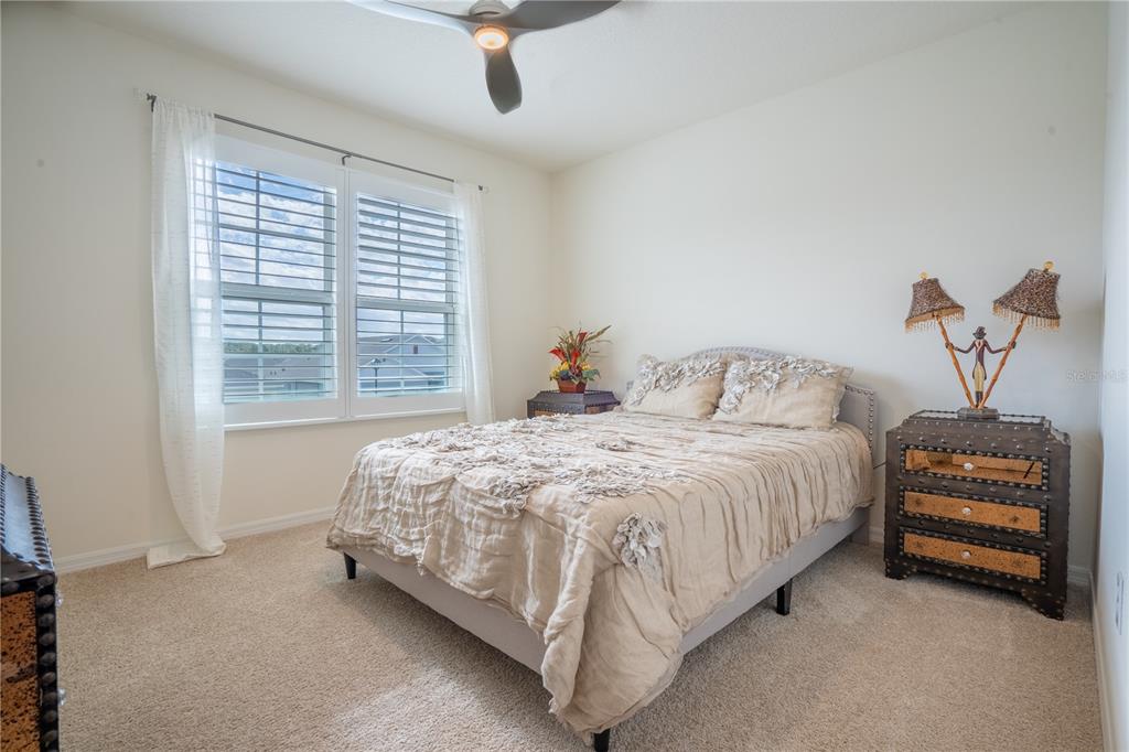 2540 Harmonia Hammock Road Harmony, FL 34773 - Photo 29 of 54 a bedroom with a bed and a window