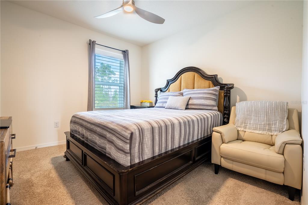 2540 Harmonia Hammock Road Harmony, FL 34773 - Photo 30 of 54 a bedroom with a bed and a window