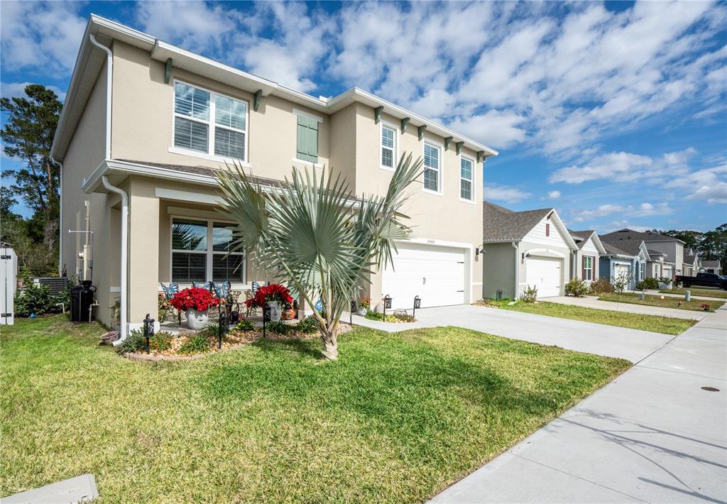 2540 Harmonia Hammock Road Harmony, FL 34773 - Photo 3 of 54 a front view of house with yard