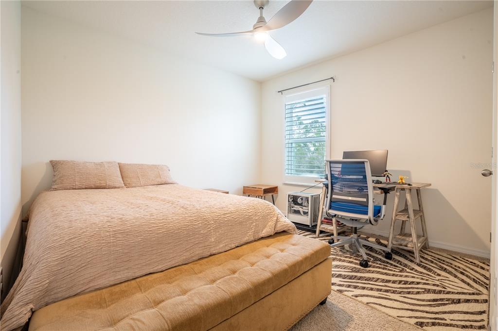 2540 Harmonia Hammock Road Harmony, FL 34773 - Photo 31 of 54 a bedroom with a bed and a table