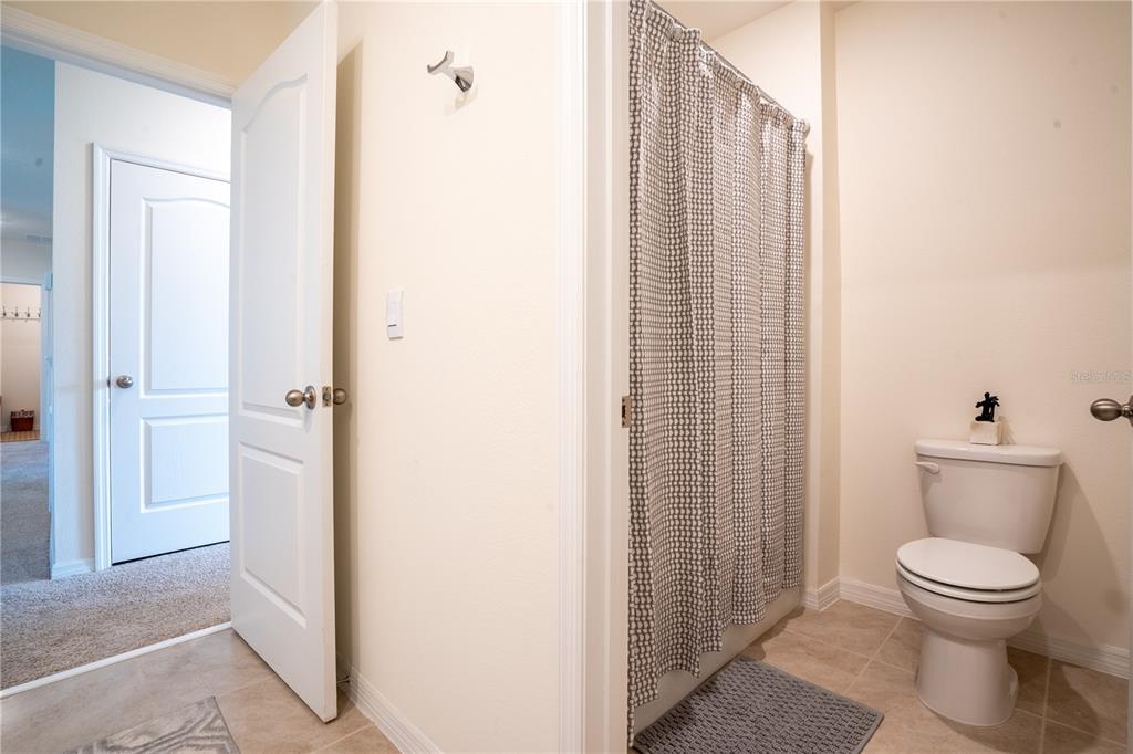 2540 Harmonia Hammock Road Harmony, FL 34773 - Photo 32 of 54 a bathroom with a toilet and a shower