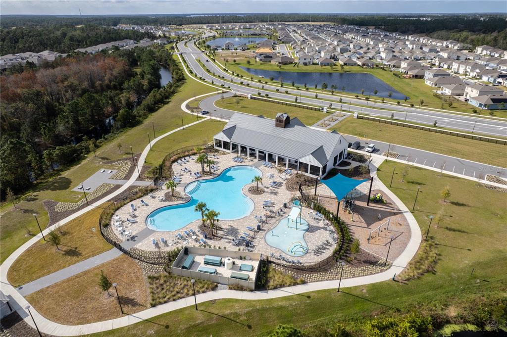 2540 Harmonia Hammock Road Harmony, FL 34773 - Photo 39 of 54 a view of a swimming pool with a sitting space