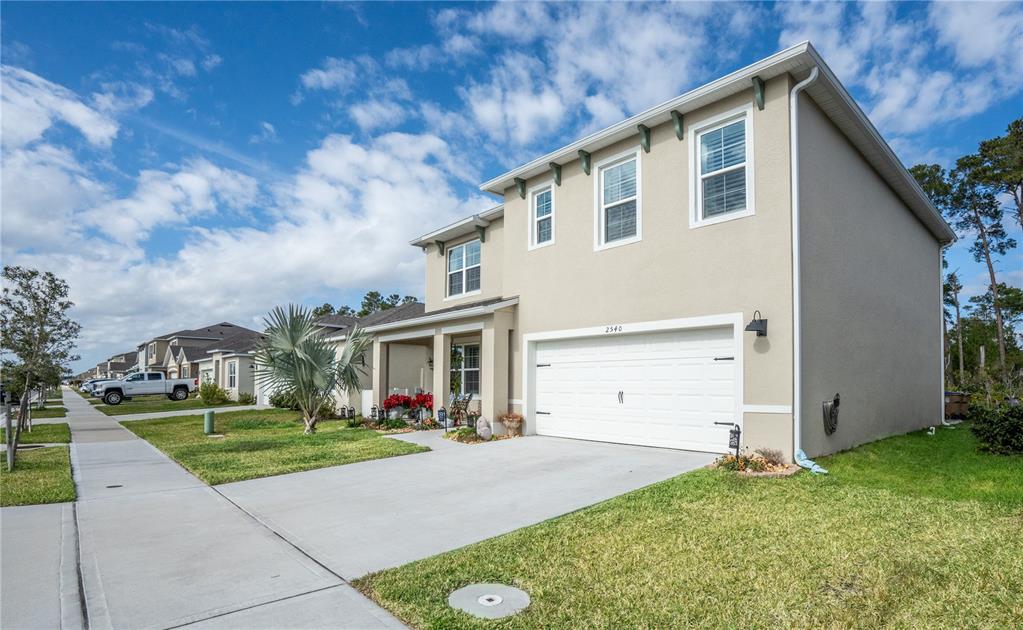 2540 Harmonia Hammock Road Harmony, FL 34773 - Photo 4 of 54 a front view of house with yard