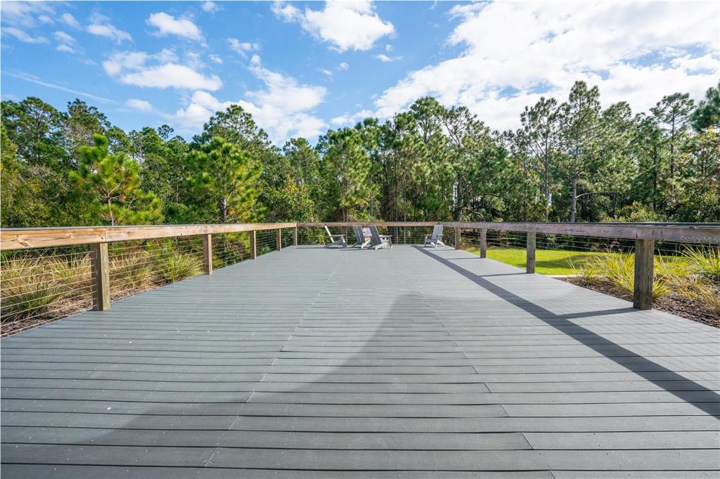2540 Harmonia Hammock Road Harmony, FL 34773 - Photo 41 of 54 a view of a swimming pool with a patio and a yard