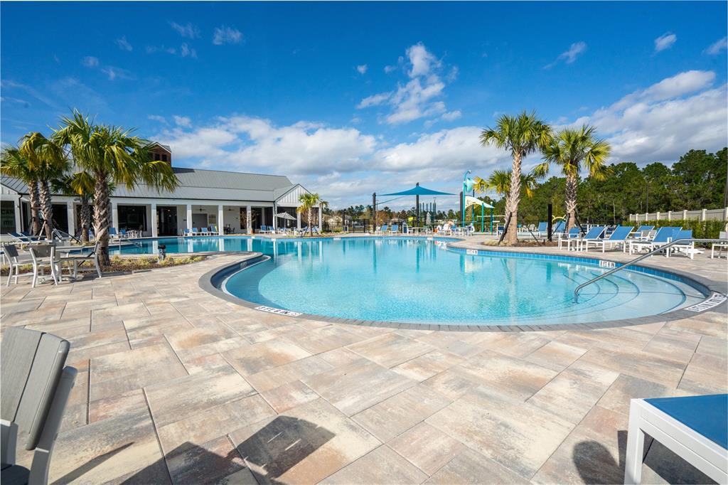 2540 Harmonia Hammock Road Harmony, FL 34773 - Photo 43 of 54 a view of a swimming pool with a patio