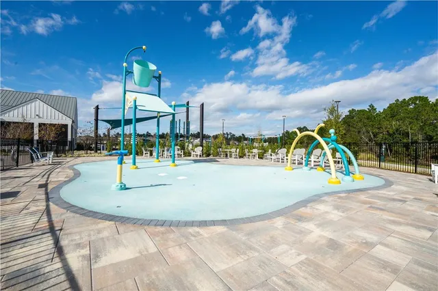 a view of a swimming pool with a yard