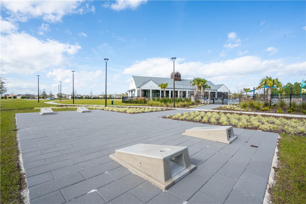 2540 Harmonia Hammock Road Harmony, FL 34773 - Photo 50 of 54 a view of a swimming pool and a yard