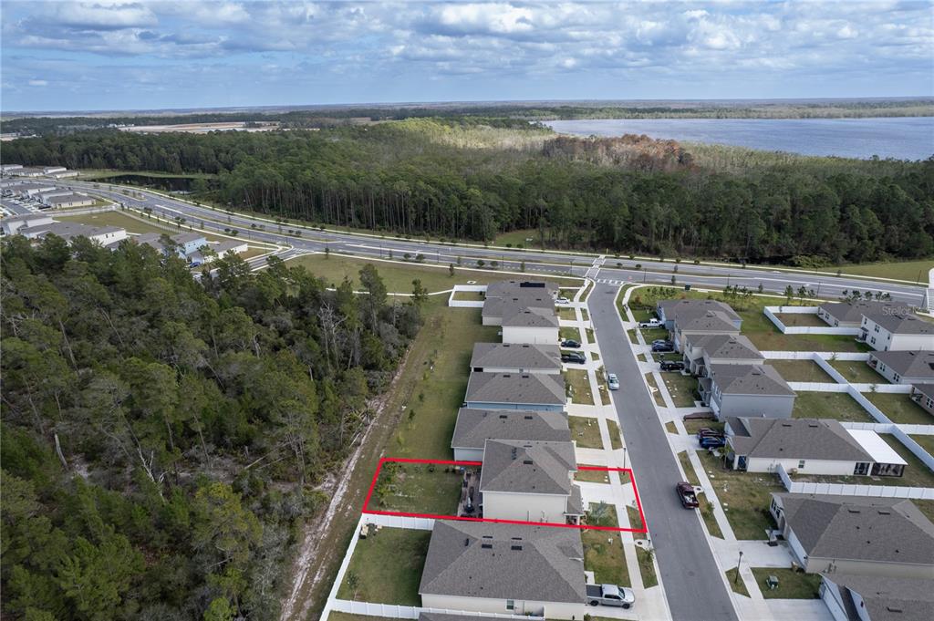 2540 Harmonia Hammock Road Harmony, FL 34773 - Photo 51 of 54 a aerial view of a yard with a lake view