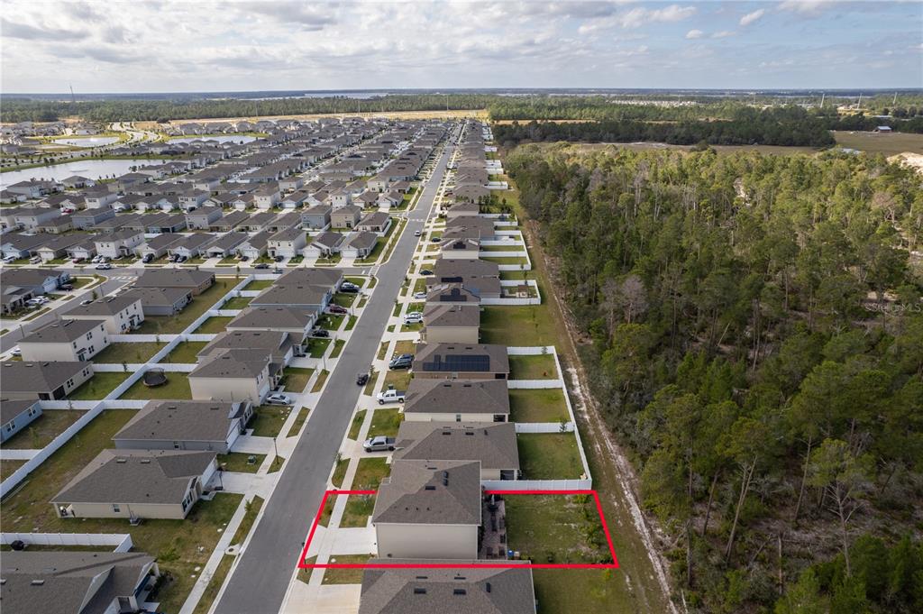 2540 Harmonia Hammock Road Harmony, FL 34773 - Photo 53 of 54 an aerial view of residential houses with outdoor space