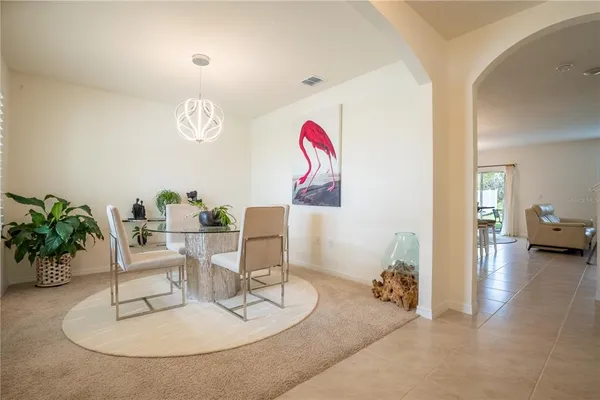 a living room with furniture and a table