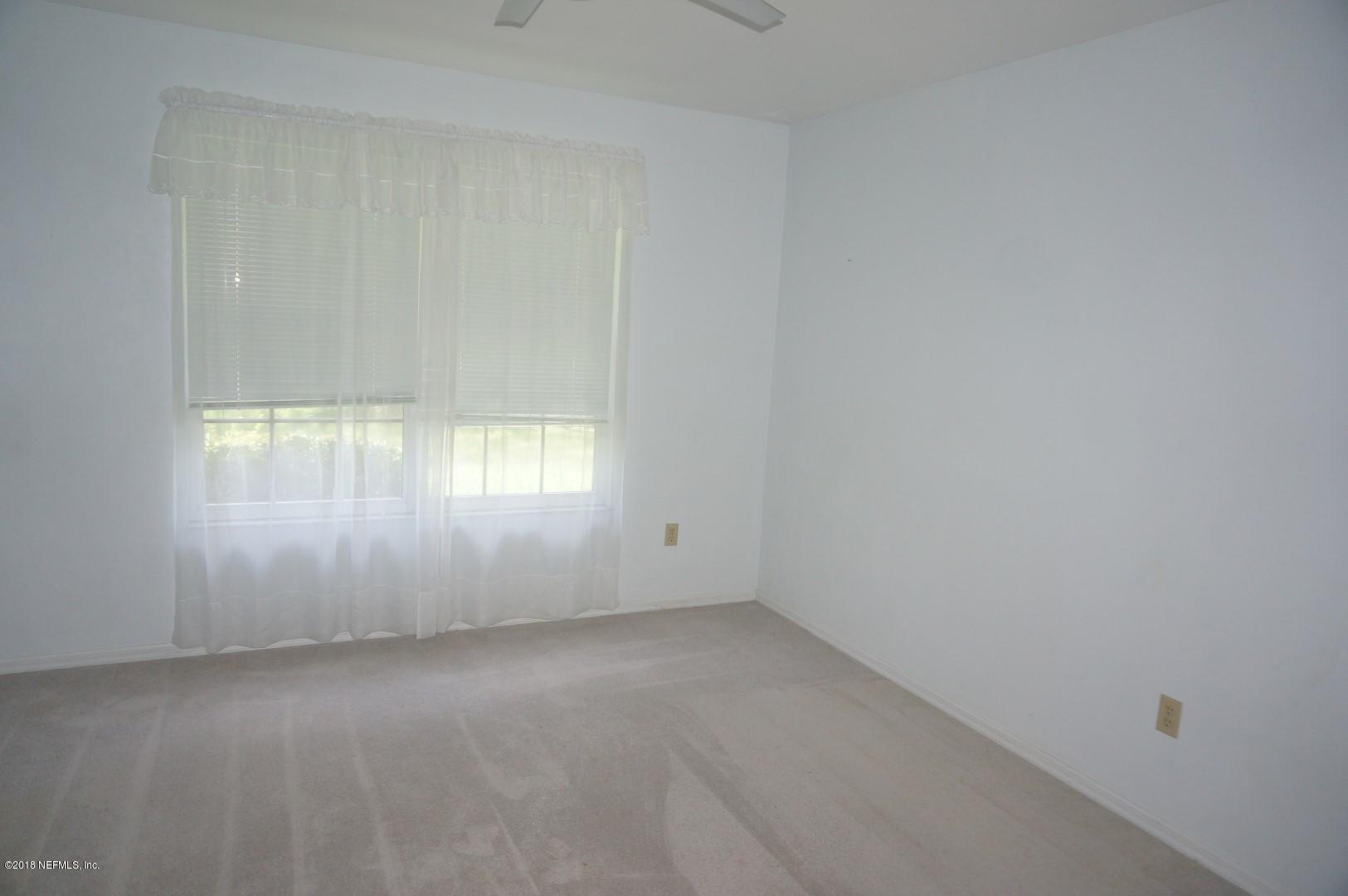6511 Brooklyn Bay Road Keystone Heights, FL 32656 - Photo 12 of 25 an empty room with windows