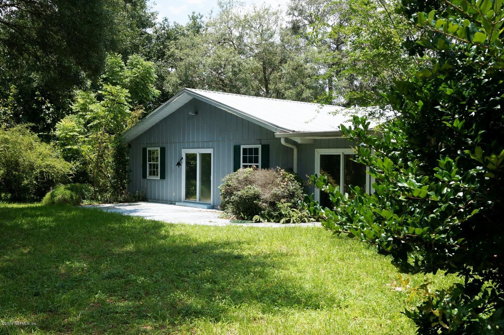 6511 Brooklyn Bay Road Keystone Heights, FL 32656 - Photo 3 of 25 a front view of house with yard and green space