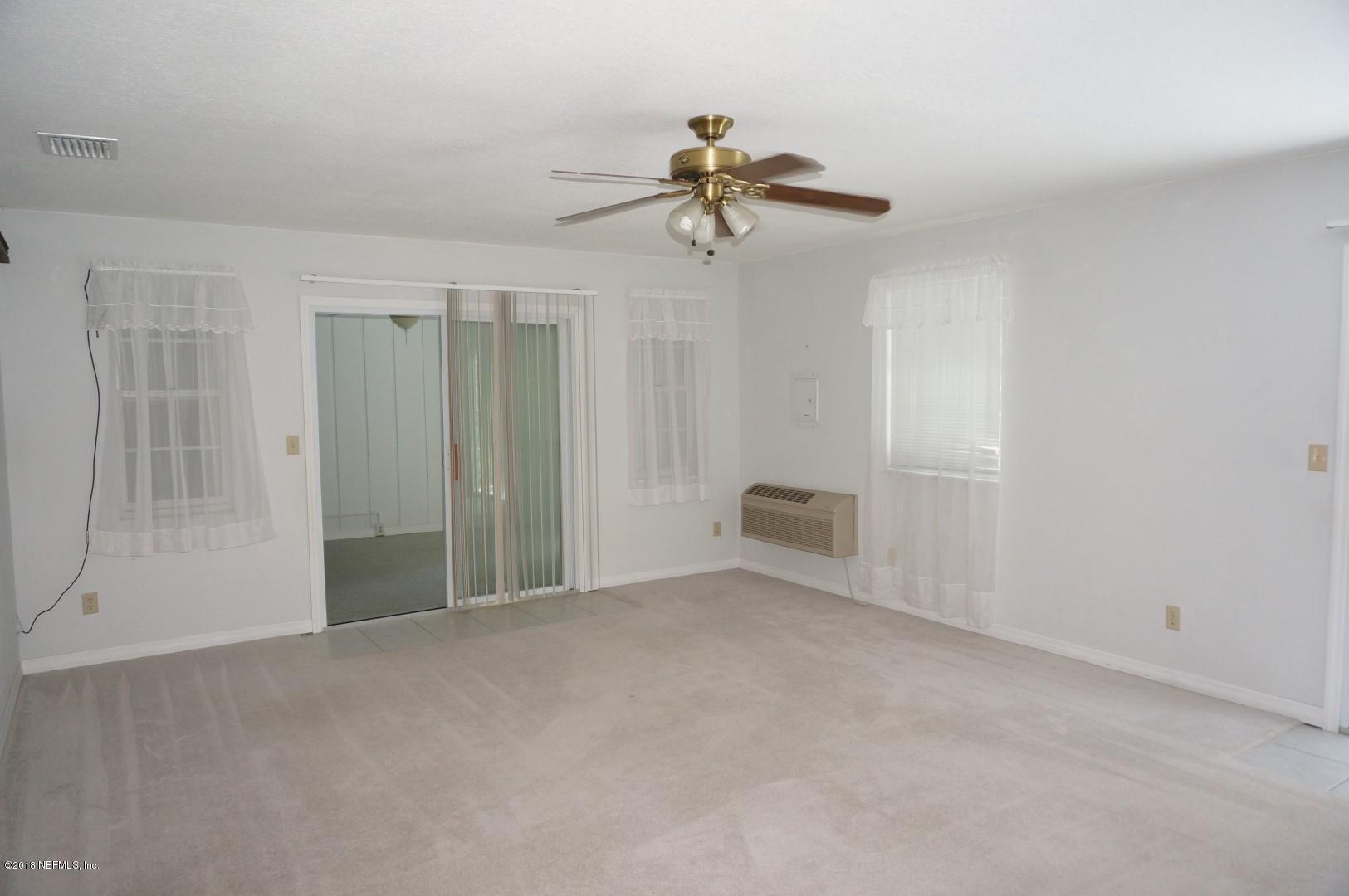 6511 Brooklyn Bay Road Keystone Heights, FL 32656 - Photo 9 of 25 a view of a room with a ceiling fan and shower