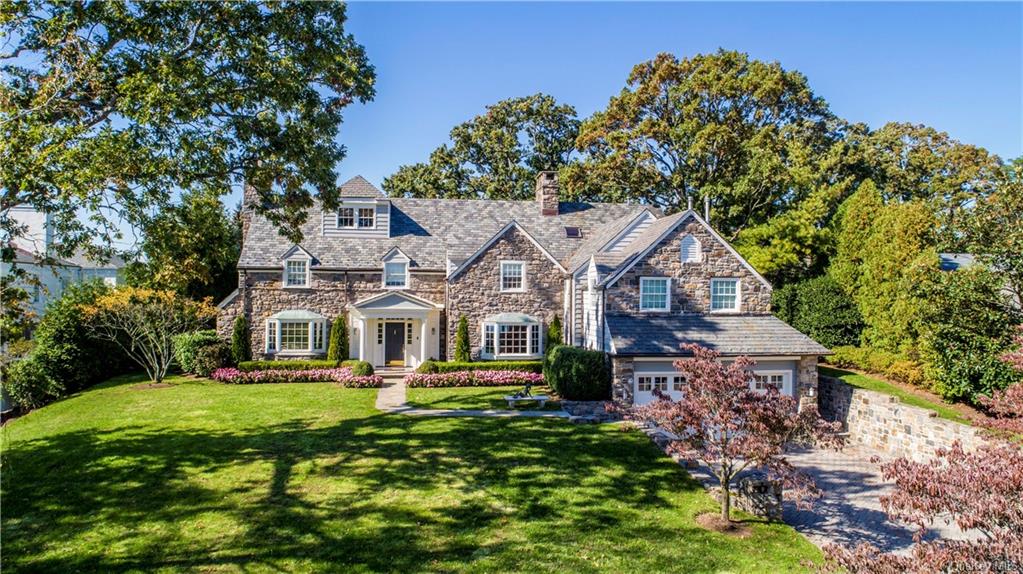 1251 Flagler Drive Mamaroneck, NY 10543 - Photo 1 of 1 a front view of a house with a garden