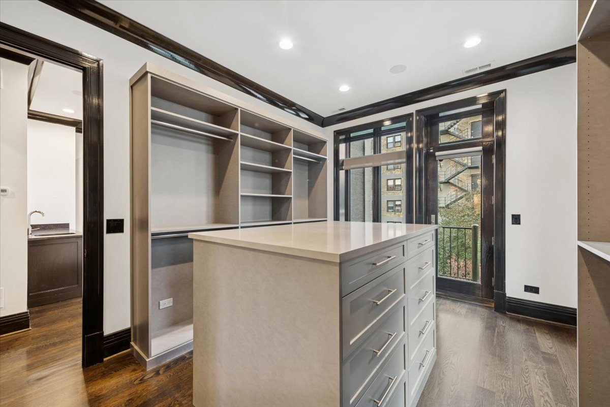 457 West Deming Place Chicago, IL 60614 - Photo 14 of 63 a kitchen with a refrigerator and a sink