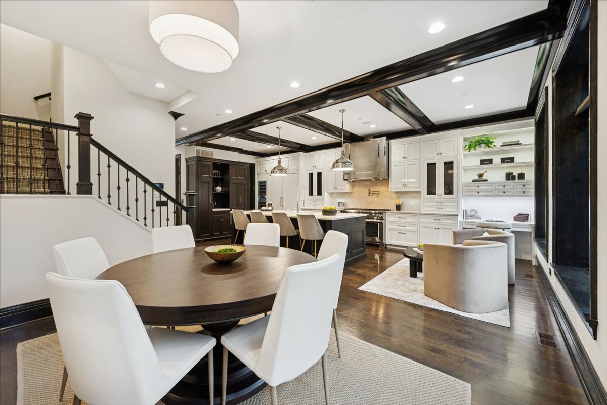 457 West Deming Place Chicago, IL 60614 - Photo 4 of 63 a dining room with stainless steel appliances granite countertop a table chairs and a microwave