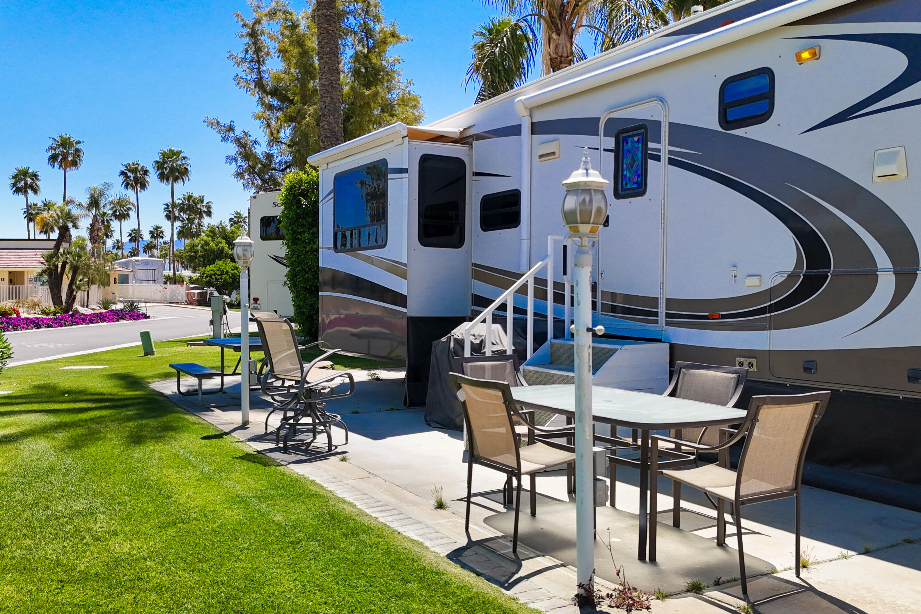 69411 Ramon Road, Unit 504 Cathedral City, CA 92234 - Photo 11 of 56 a view of a chairs and table in the patio