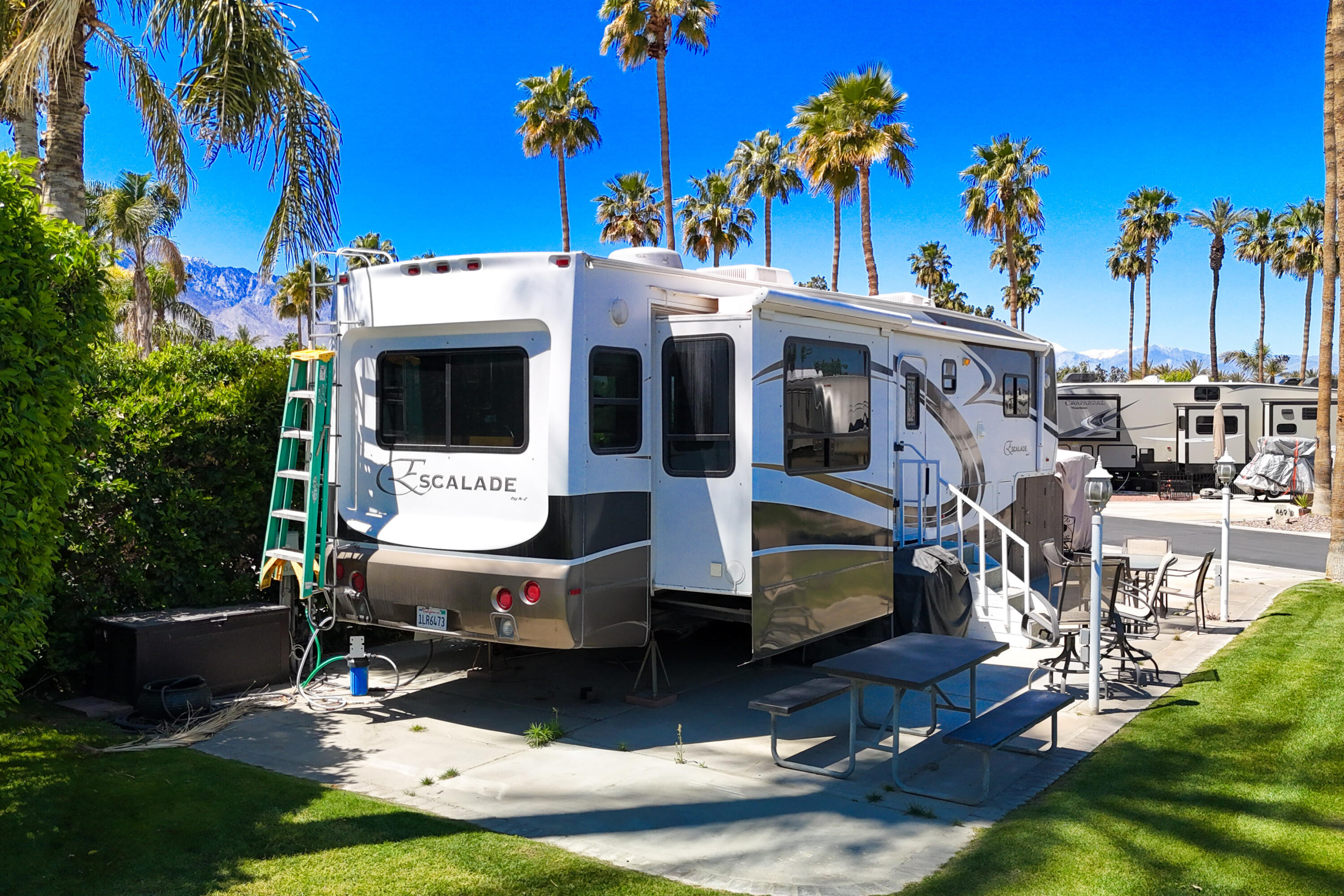 69411 Ramon Road, Unit 504 Cathedral City, CA 92234 - Photo 15 of 56 a view of a house with swimming pool and sitting area