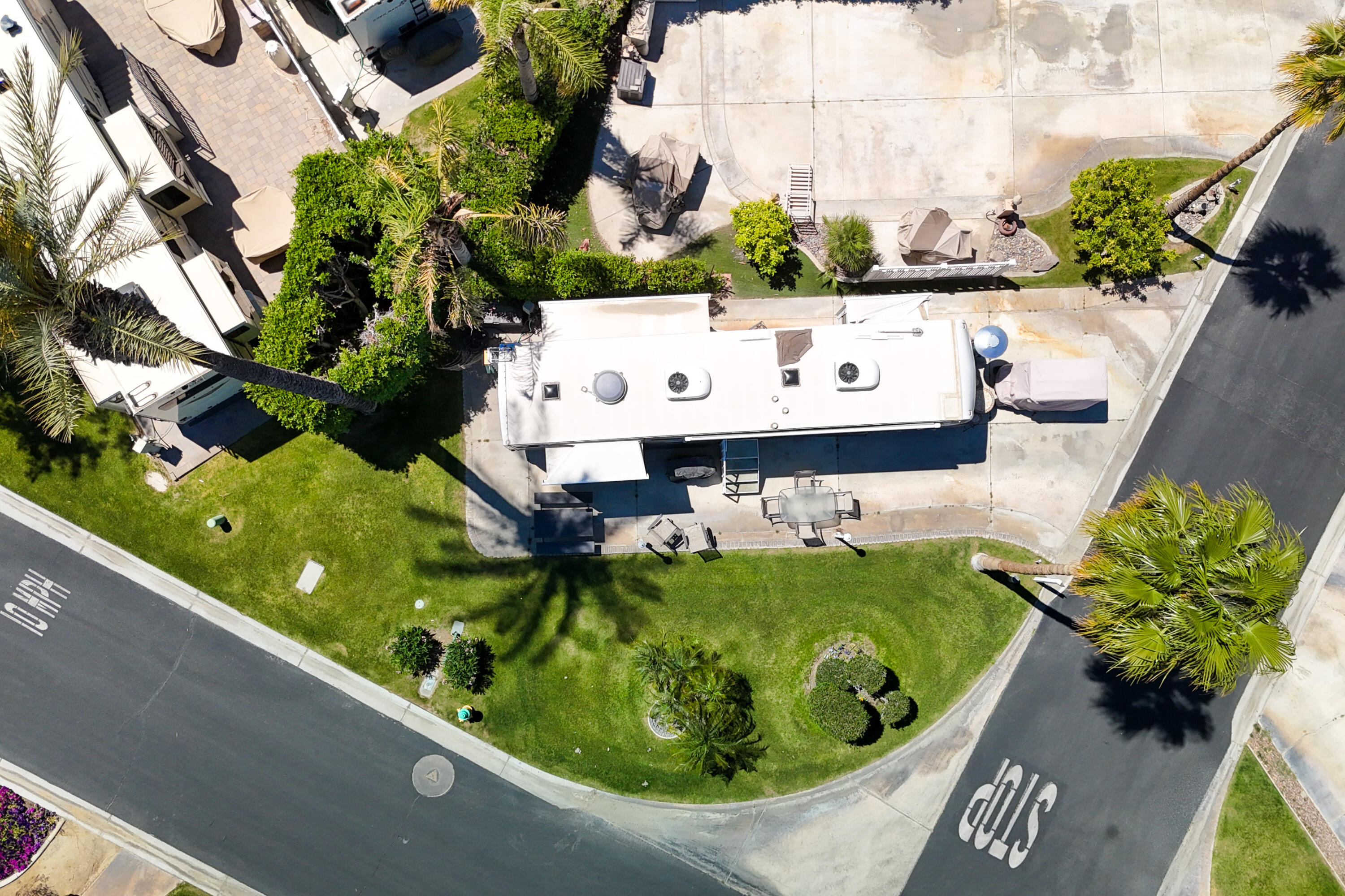 69411 Ramon Road, Unit 504 Cathedral City, CA 92234 - Photo 19 of 56 a view of a swimming pool with a yard and plants