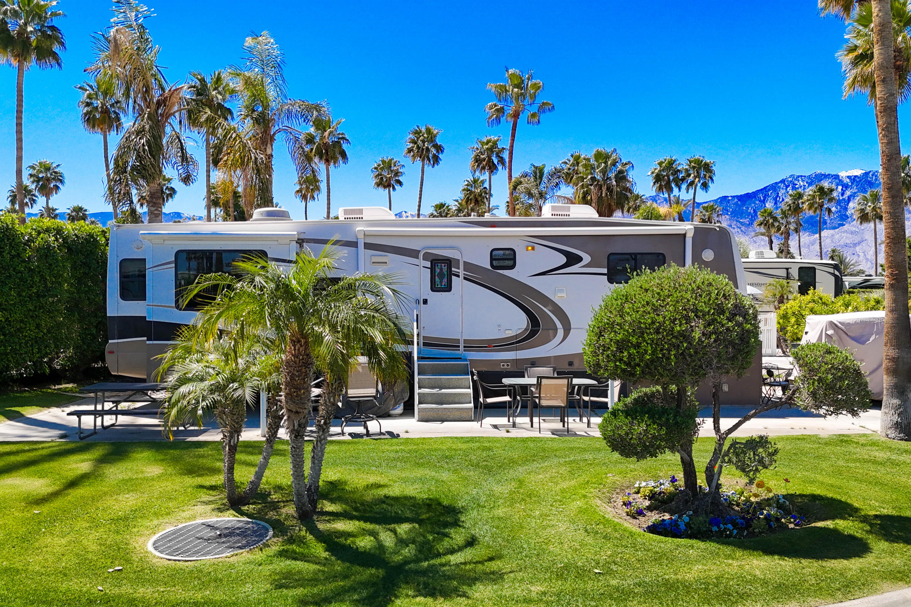 69411 Ramon Road, Unit 504 Cathedral City, CA 92234 - Photo 2 of 56 a view of a swimming pool with a garden