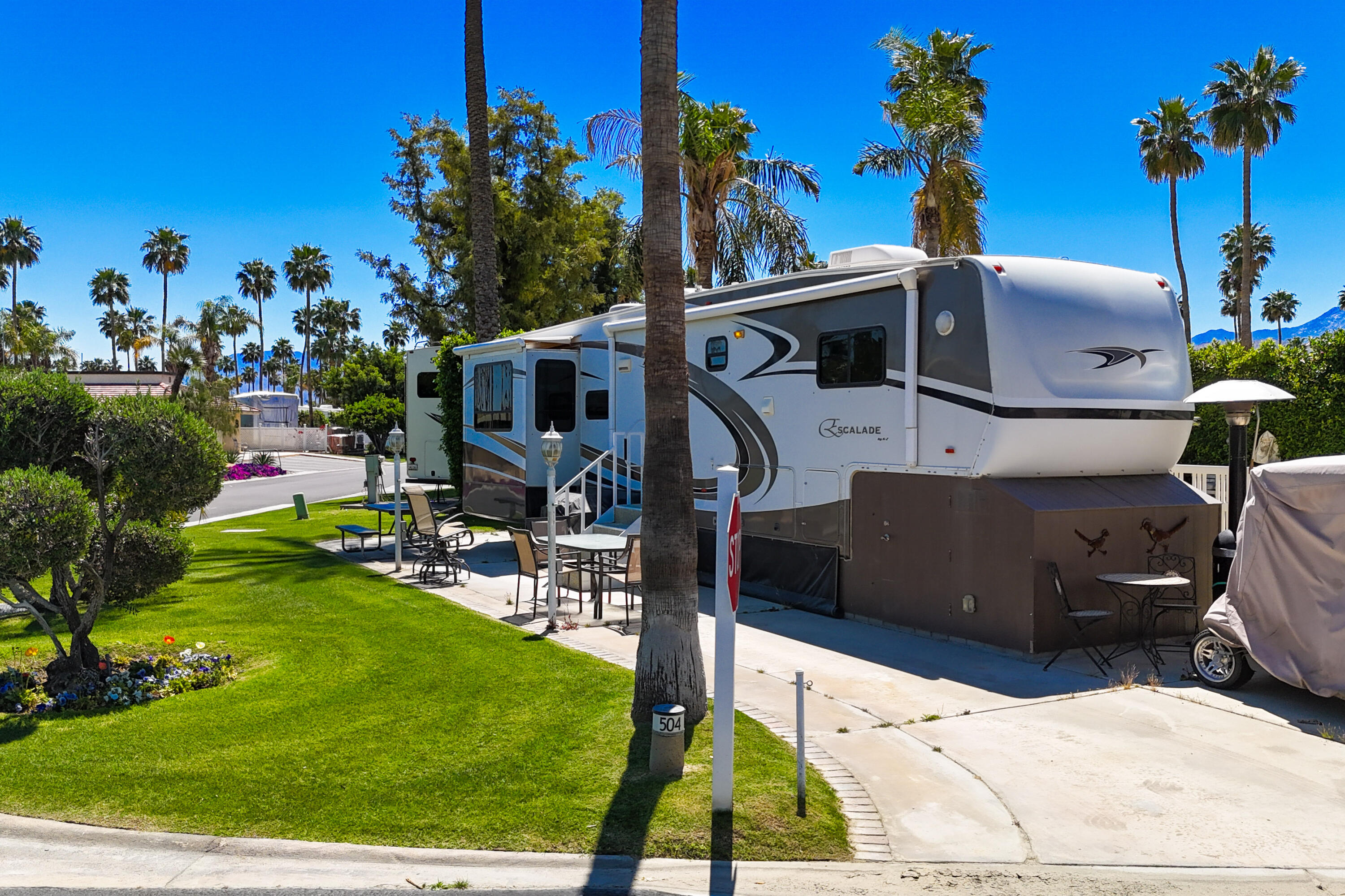 69411 Ramon Road, Unit 504 Cathedral City, CA 92234 - Photo 6 of 56 a front view of a house with garden