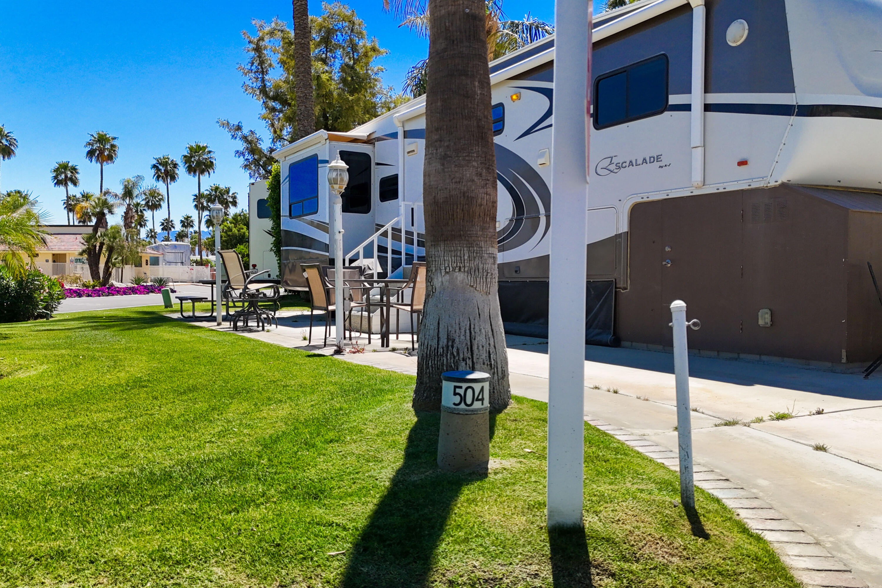 69411 Ramon Road, Unit 504 Cathedral City, CA 92234 - Photo 9 of 56 a swimming pool with yard in the back