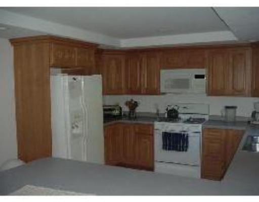 30 Concord Road Billerica, MA 01821 - Photo 8 of 10 a kitchen with stainless steel appliances granite countertop a refrigerator a stove top oven a sink and dishwasher