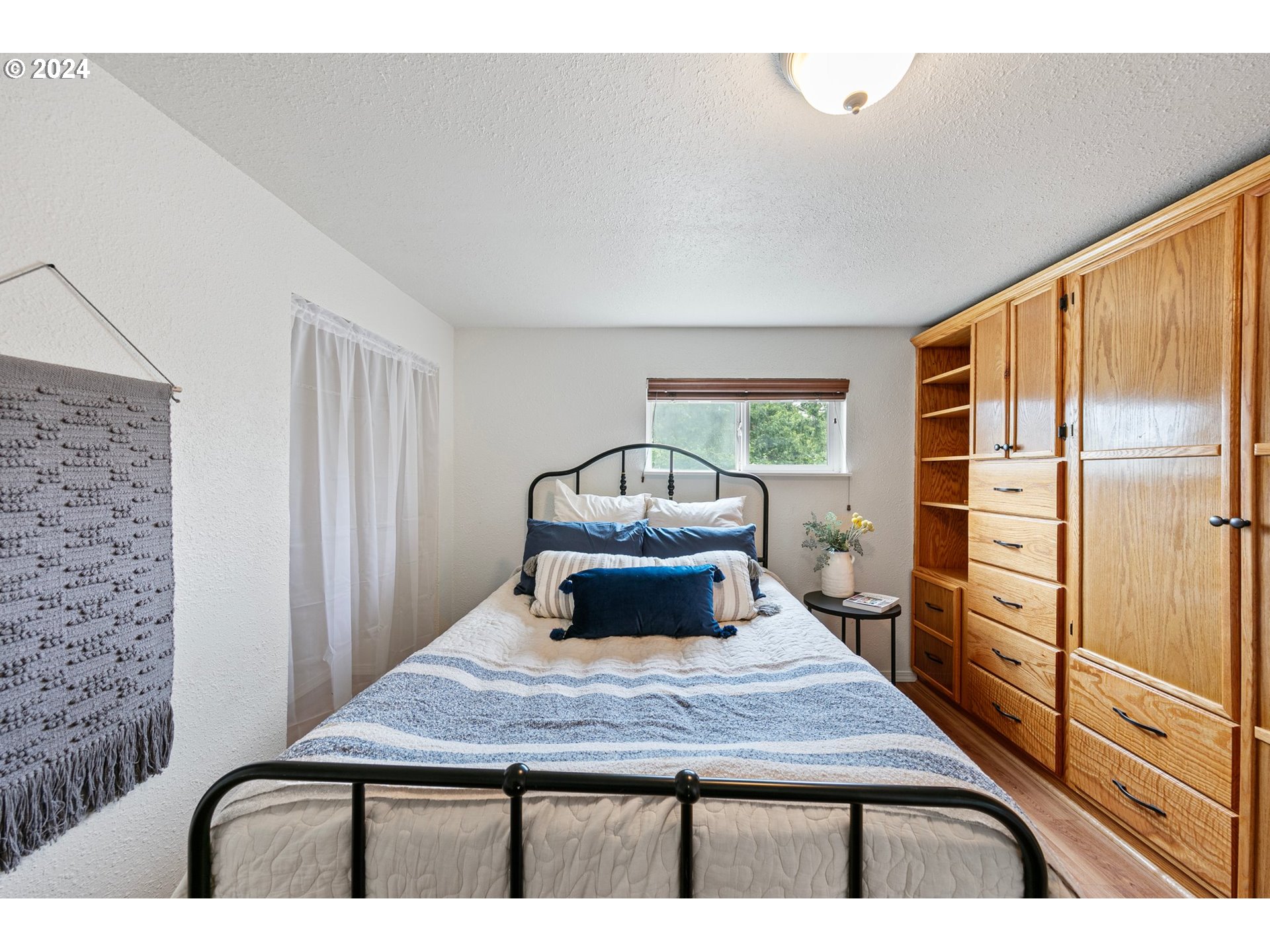 280 South 35th Street Springfield, OR 97478 - Photo 10 of 12 a room with a bed and a dresser