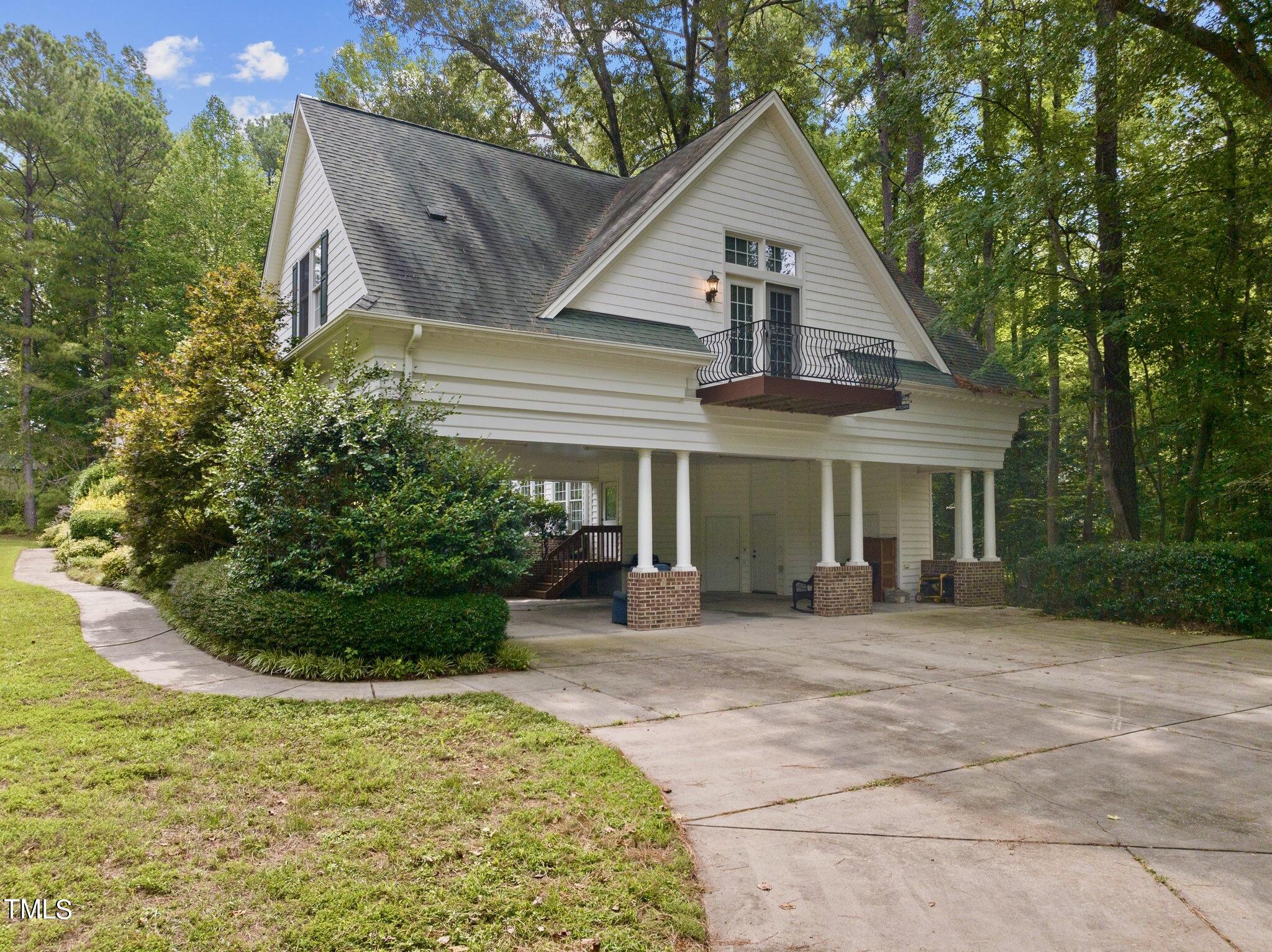 4099 Blackard Pond Road Raleigh, NC 27604 - Photo 14 of 94 a front view of a house with a garden