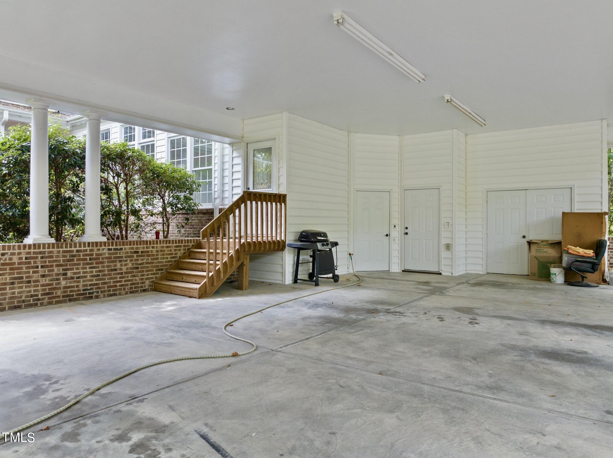 4099 Blackard Pond Road Raleigh, NC 27604 - Photo 19 of 94 a view of a bedroom with furniture and floor to ceiling window