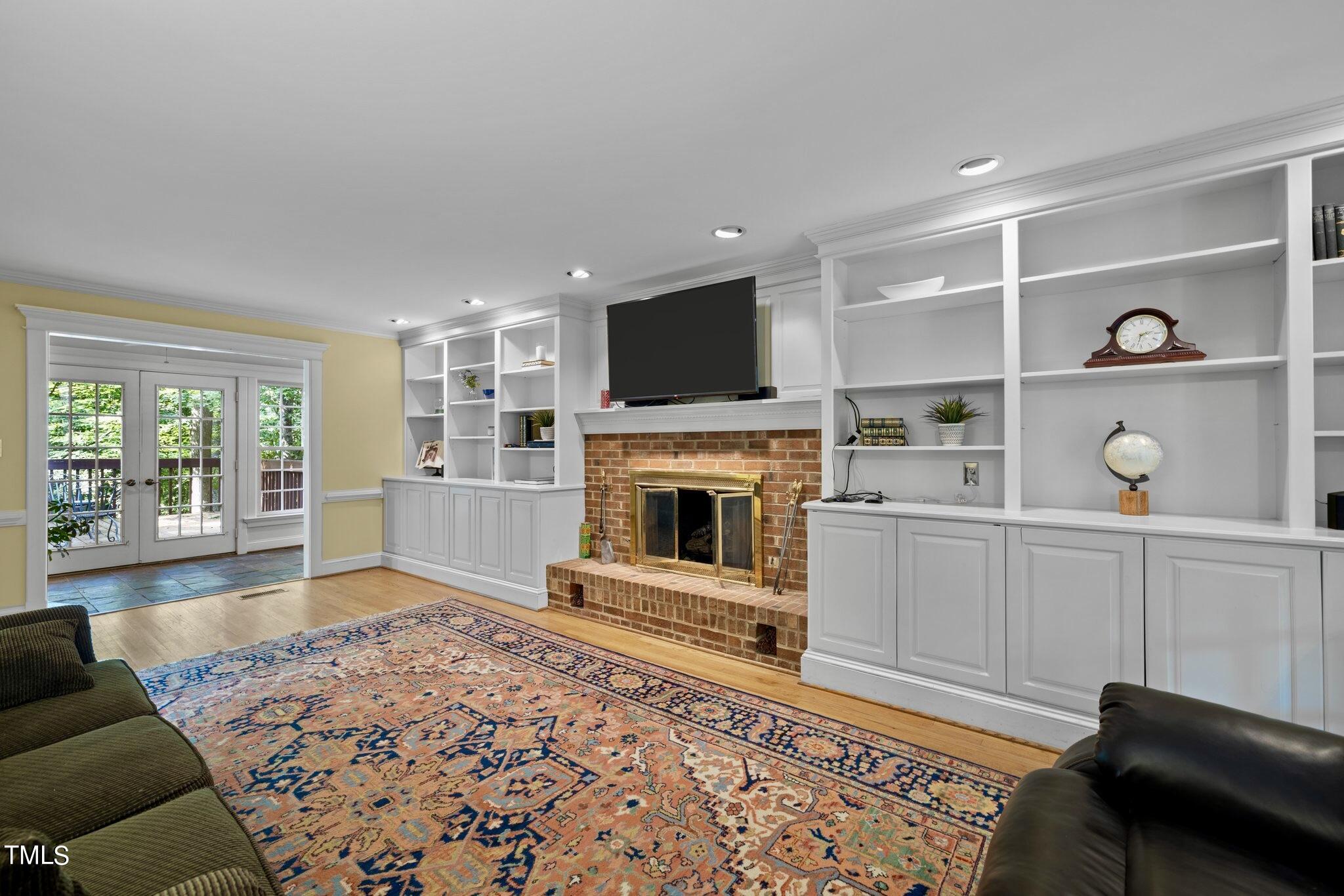 4099 Blackard Pond Road Raleigh, NC 27604 - Photo 25 of 94 a living room with furniture and a flat screen tv
