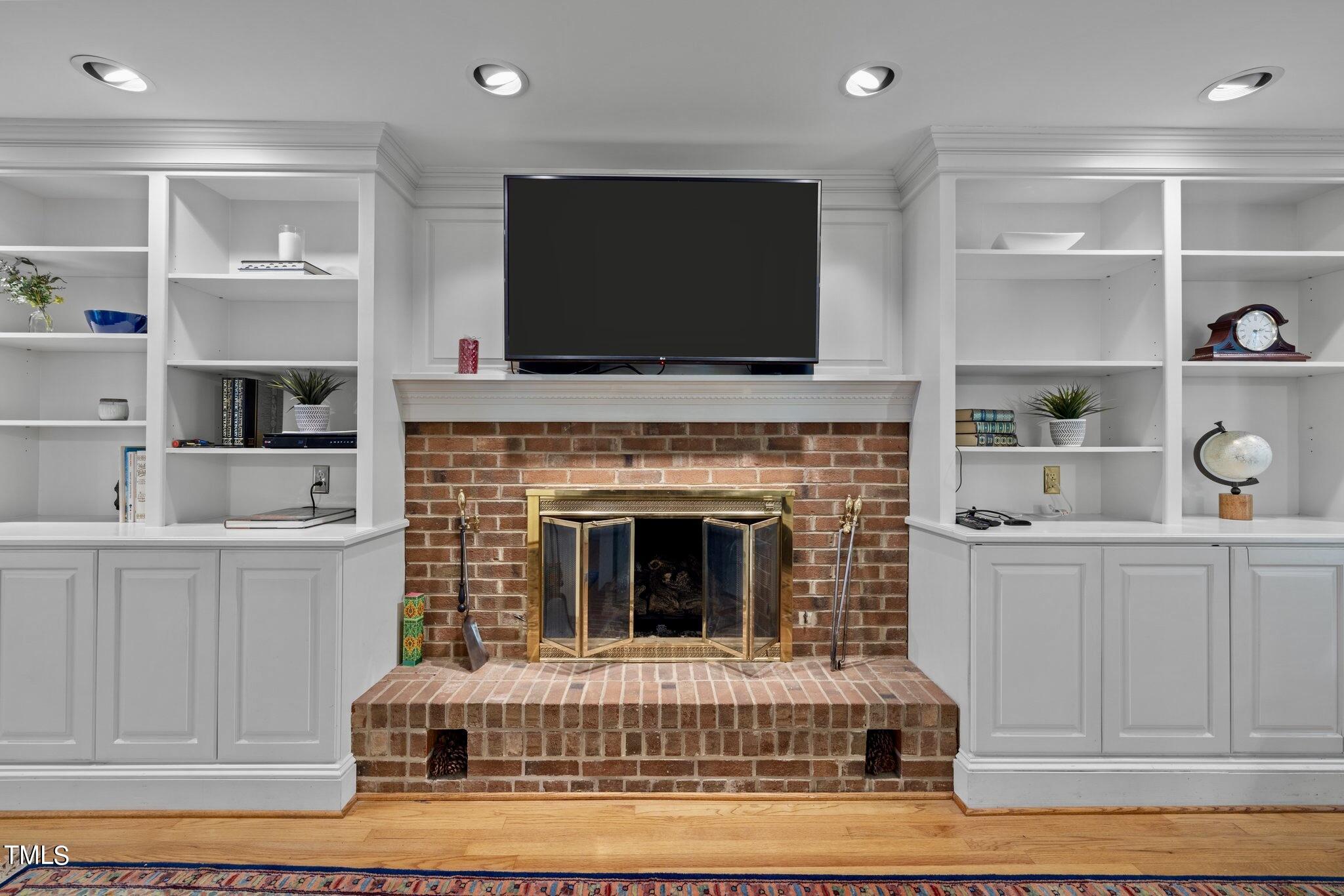 4099 Blackard Pond Road Raleigh, NC 27604 - Photo 27 of 94 a living room with furniture a flat screen tv and a fireplace
