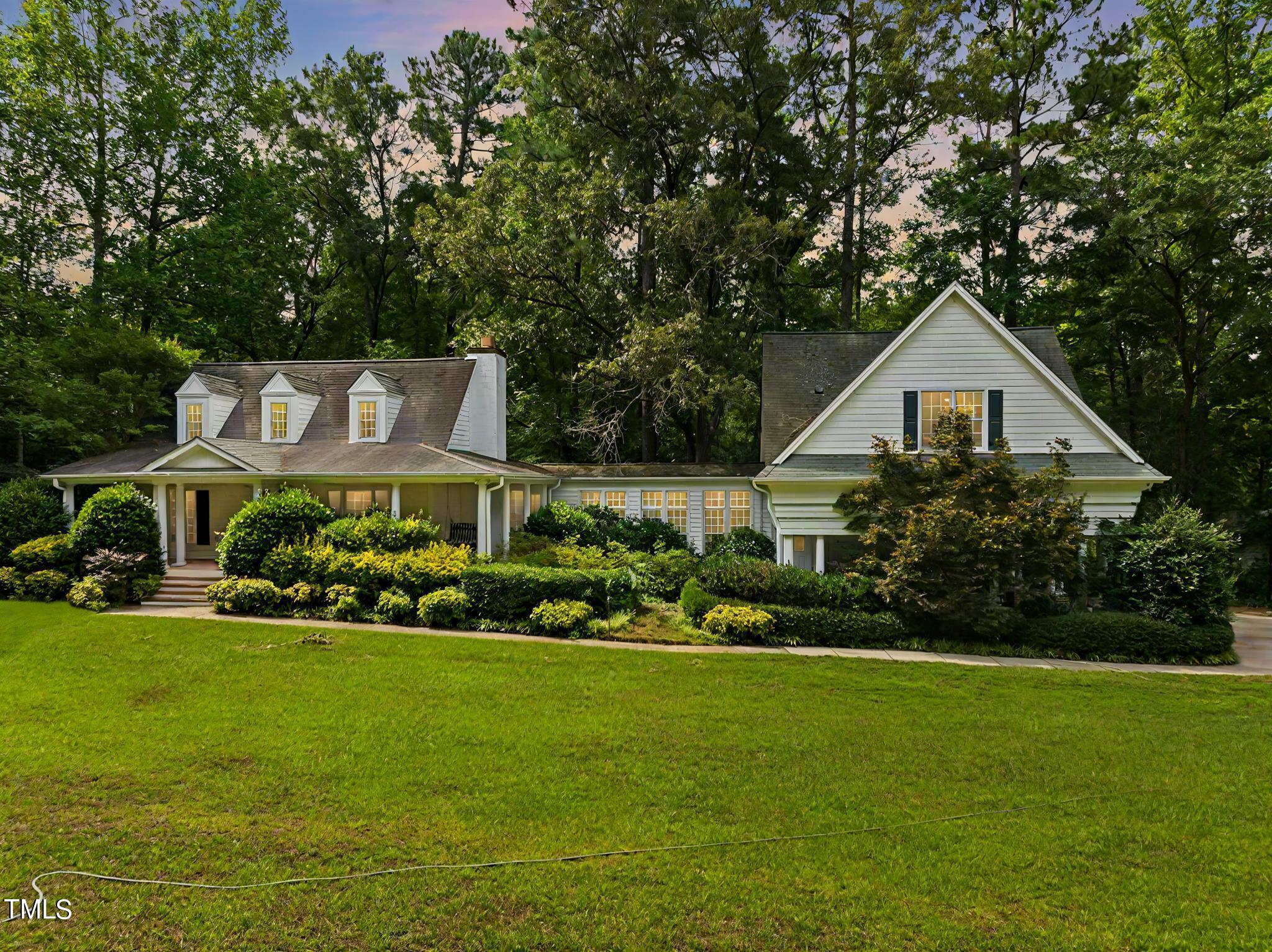 4099 Blackard Pond Road Raleigh, NC 27604 - Photo 3 of 94 a front view of a house with a garden