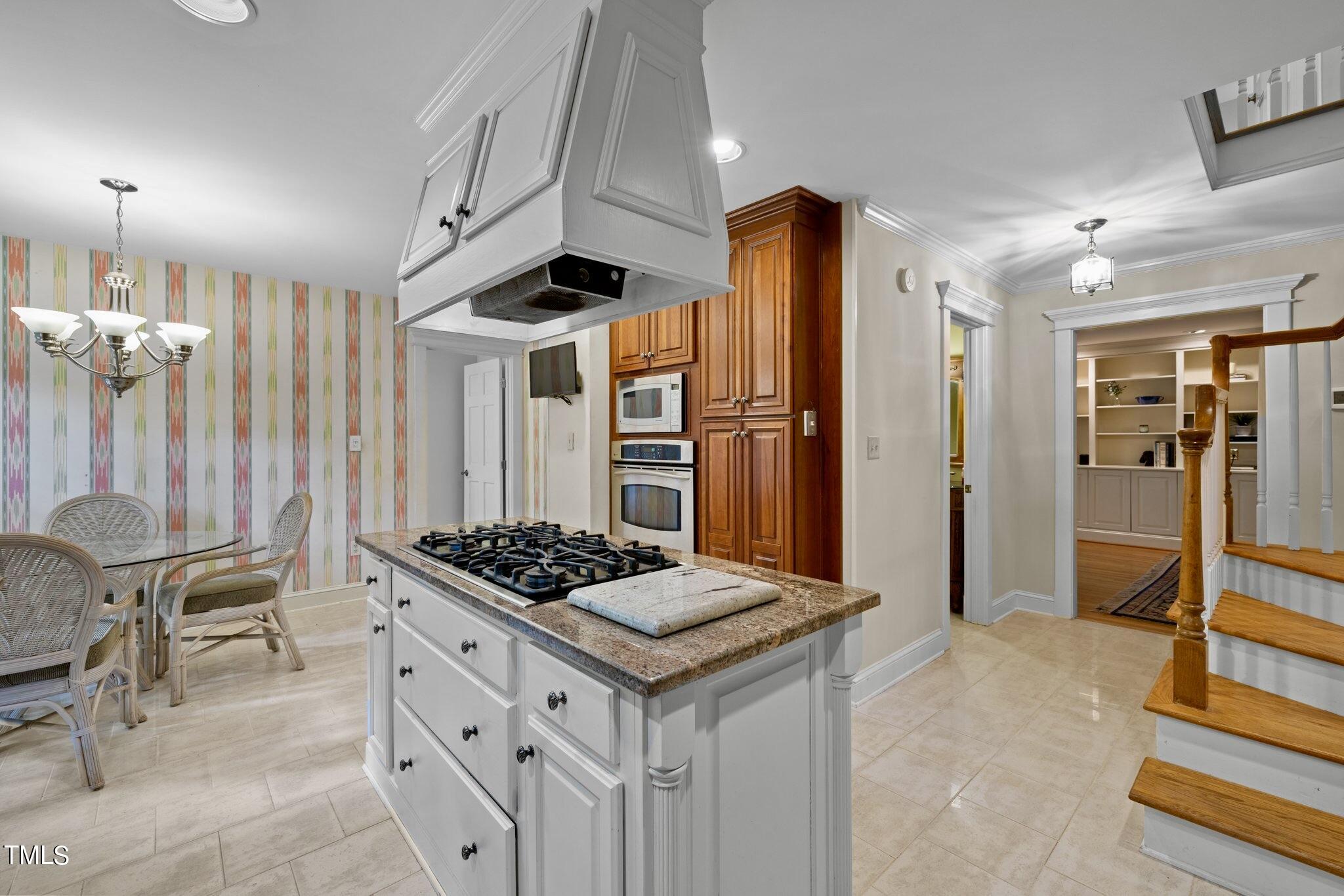 4099 Blackard Pond Road Raleigh, NC 27604 - Photo 33 of 94 a kitchen with stainless steel appliances kitchen island granite countertop a refrigerator and a stove