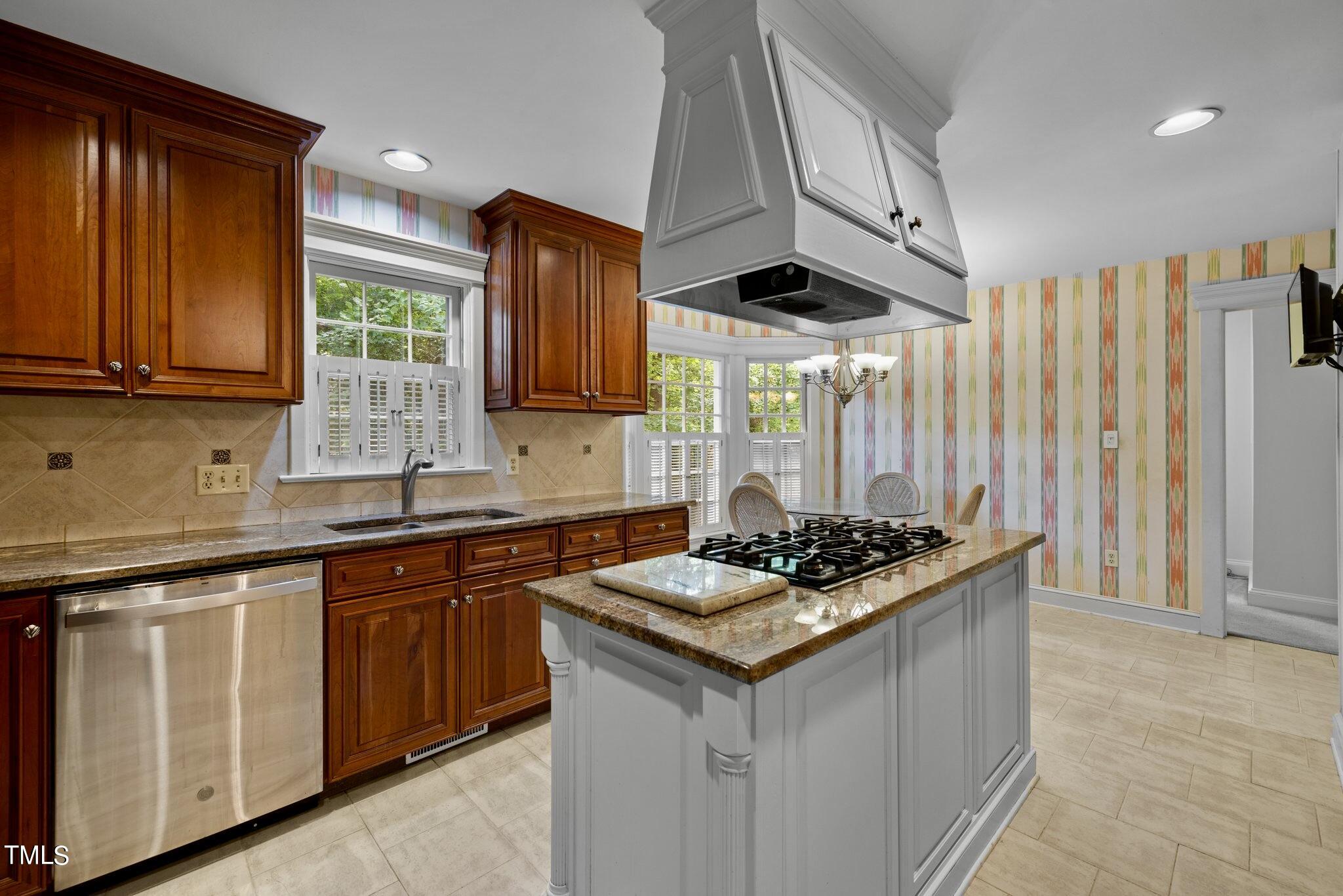 4099 Blackard Pond Road Raleigh, NC 27604 - Photo 35 of 94 a kitchen with stainless steel appliances granite countertop a sink stove and cabinets