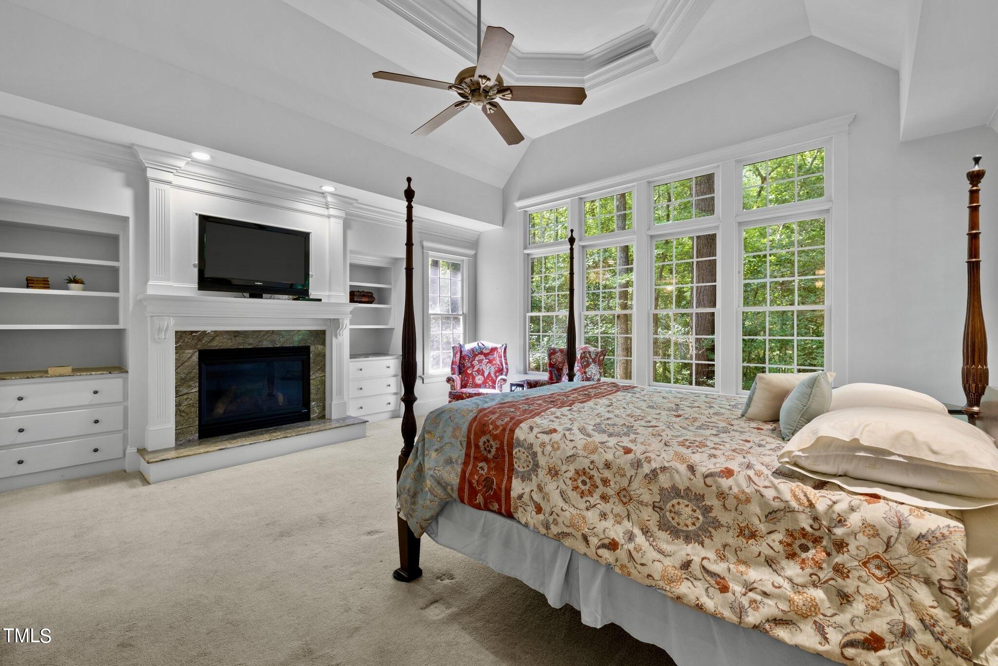 4099 Blackard Pond Road Raleigh, NC 27604 - Photo 42 of 94 a bedroom with a bed and a fireplace