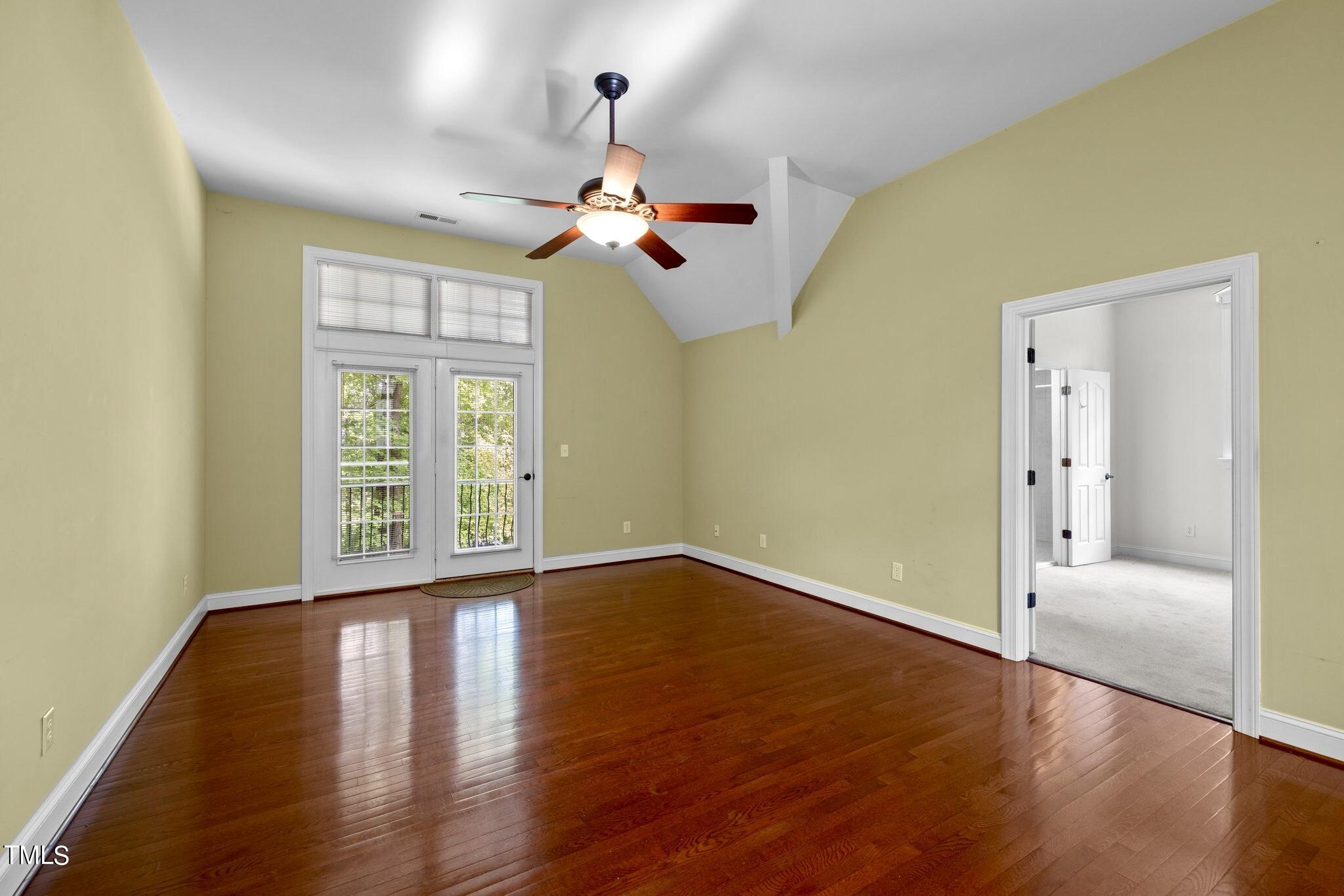 4099 Blackard Pond Road Raleigh, NC 27604 - Photo 54 of 94 a view of a bedroom with wooden floor fan and windows