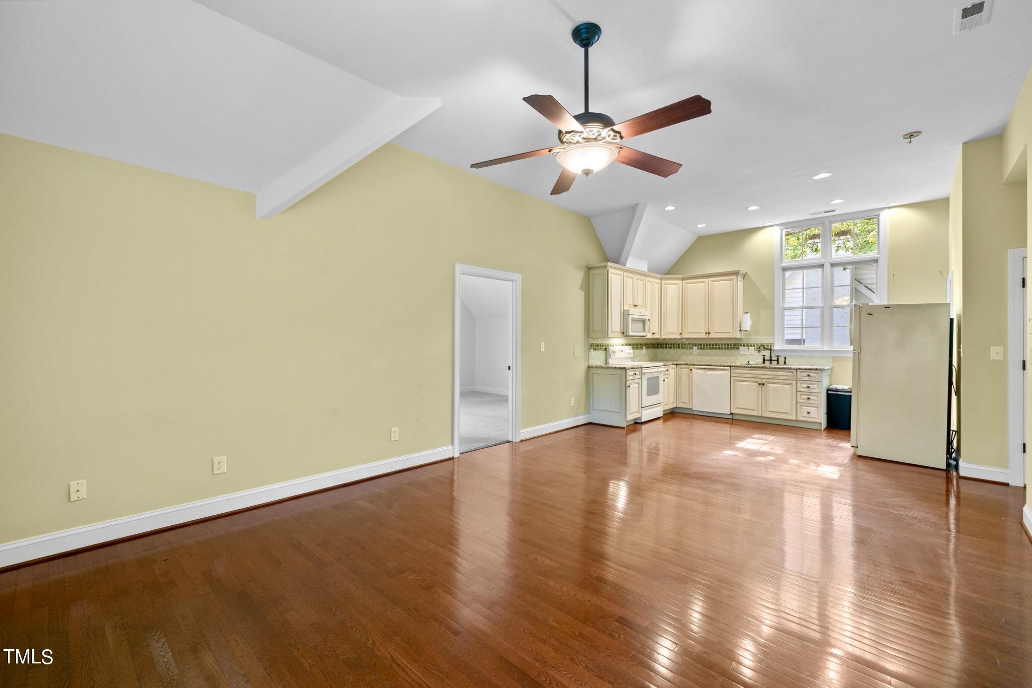 4099 Blackard Pond Road Raleigh, NC 27604 - Photo 55 of 94 a view of an empty room with kitchen view and a window