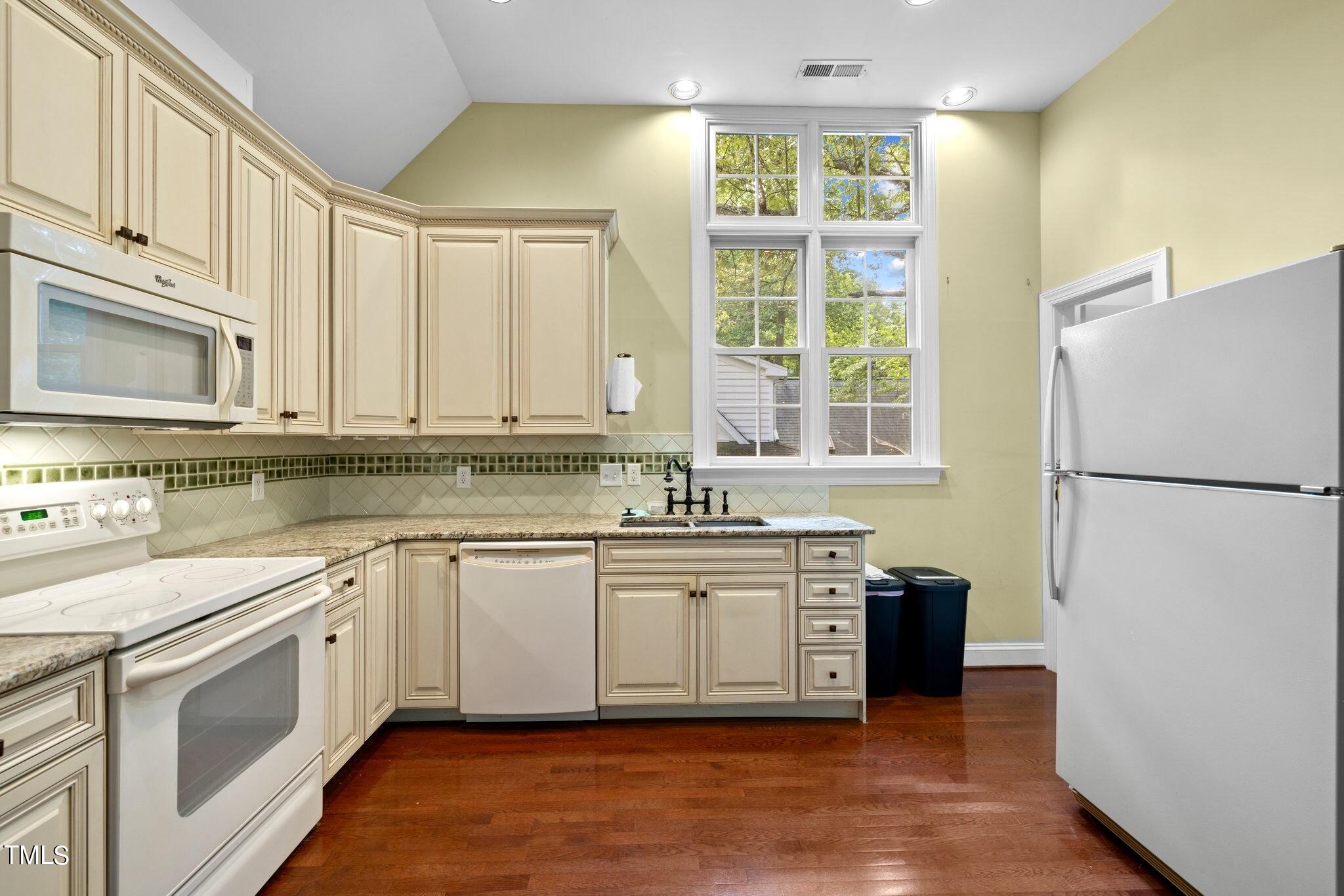 4099 Blackard Pond Road Raleigh, NC 27604 - Photo 56 of 94 a kitchen with stainless steel appliances granite countertop a stove a sink and a refrigerator