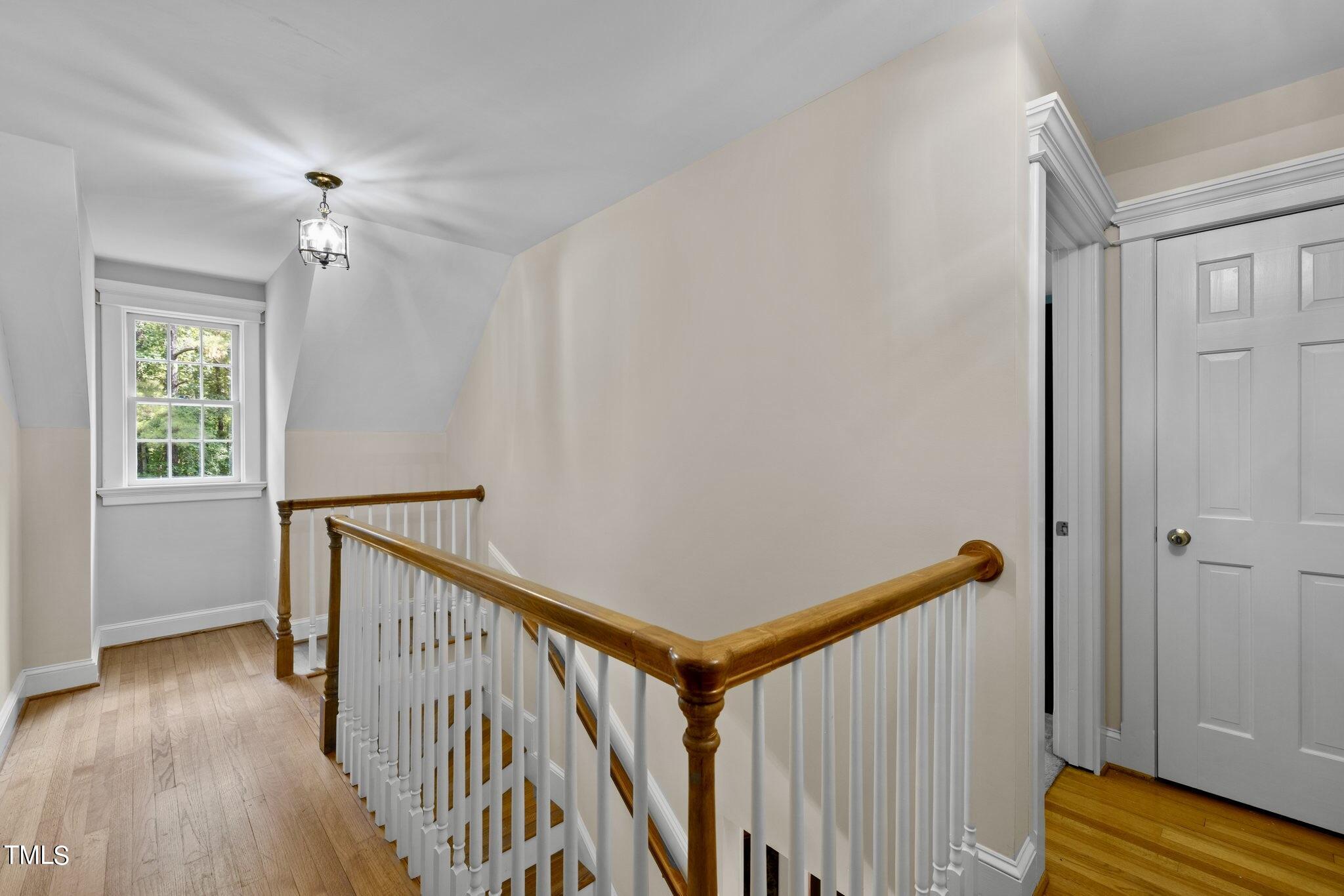 4099 Blackard Pond Road Raleigh, NC 27604 - Photo 65 of 94 a view of a hallway with wooden floor and stairs