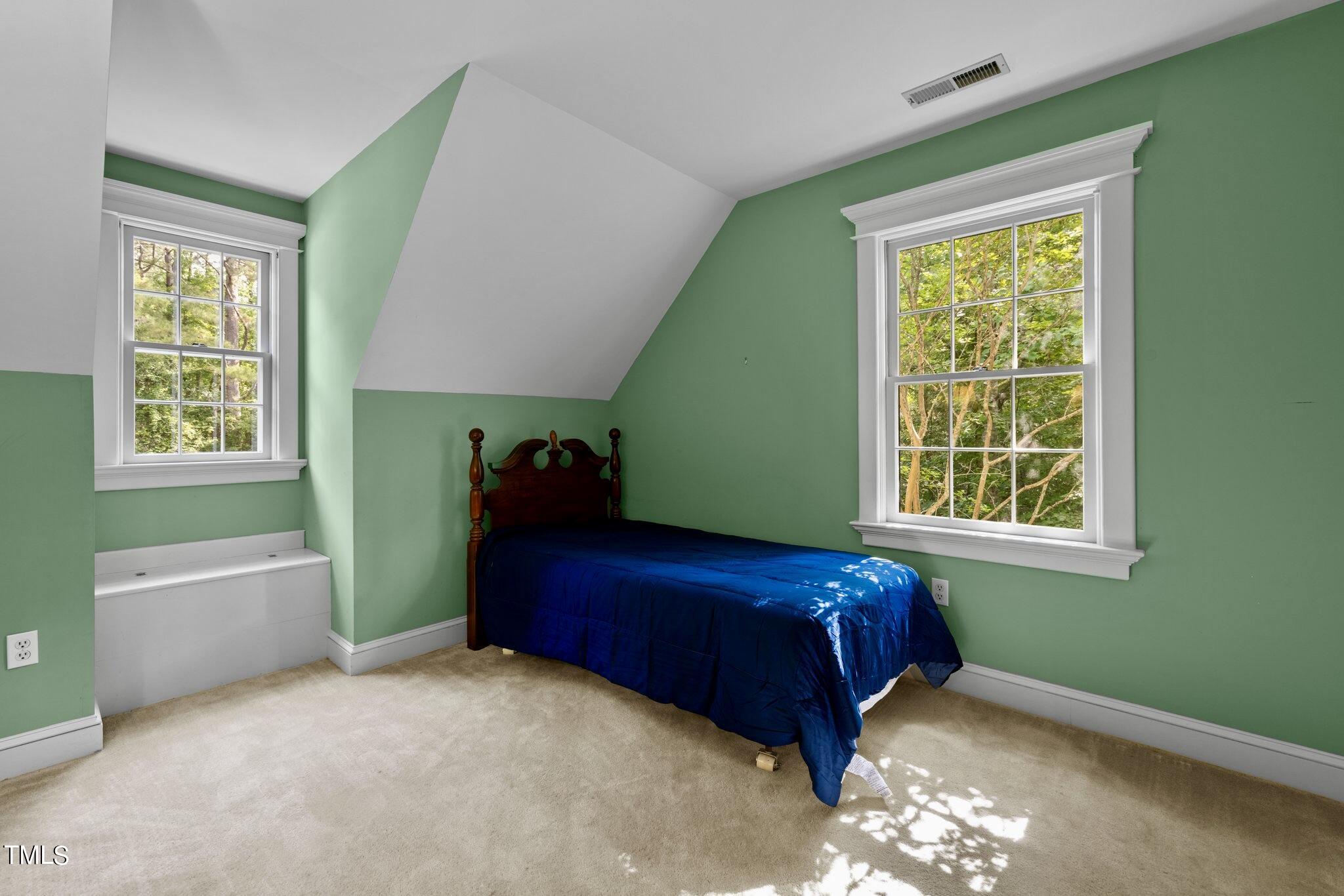 4099 Blackard Pond Road Raleigh, NC 27604 - Photo 66 of 94 a bedroom with a bed and a window