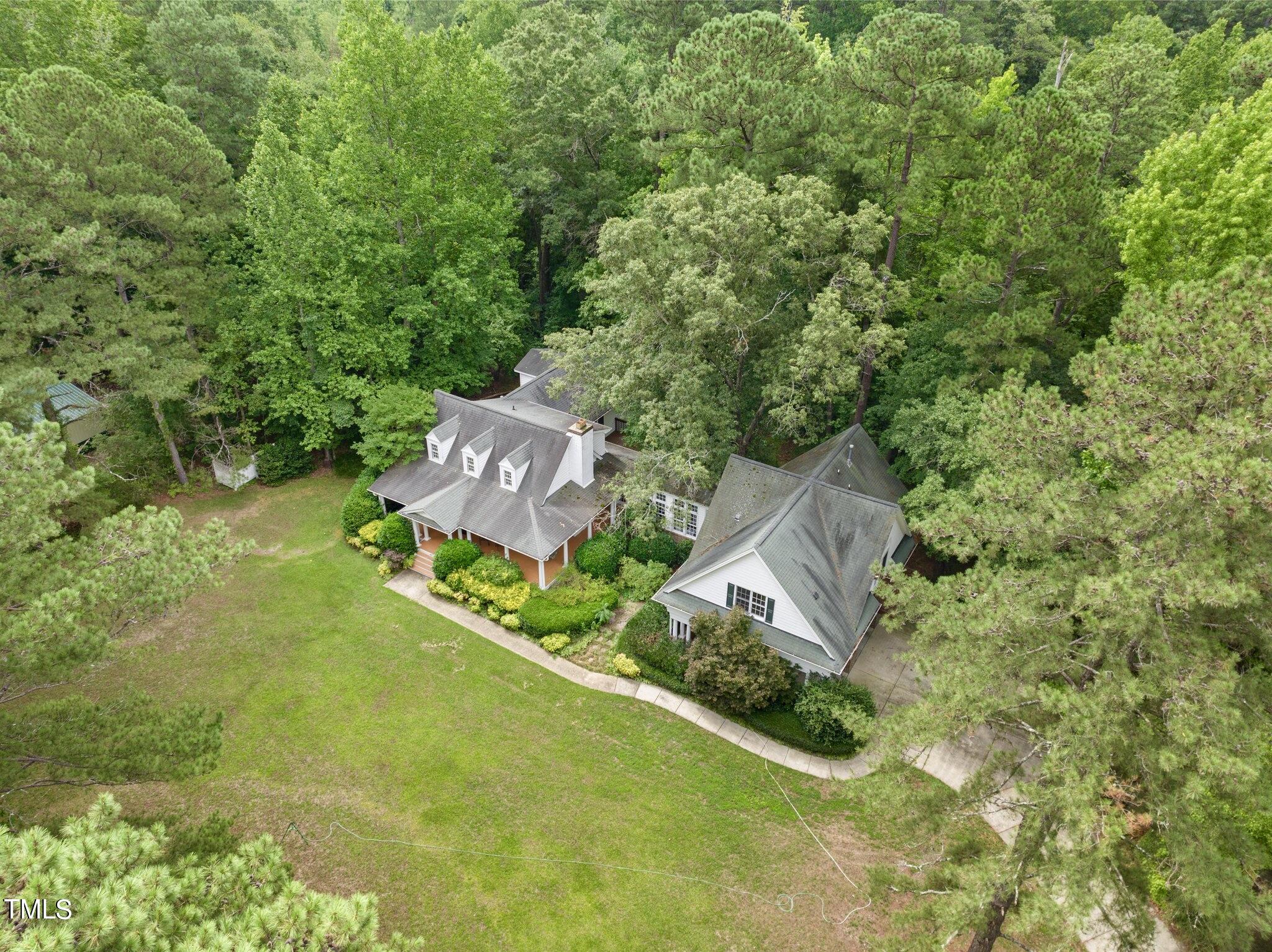 4099 Blackard Pond Road Raleigh, NC 27604 - Photo 7 of 94 an aerial view of a house with a garden and trees