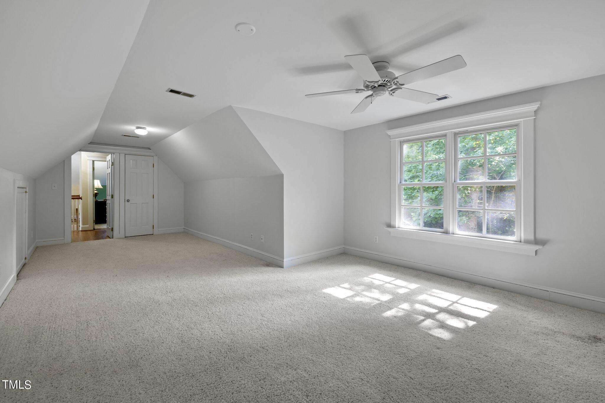 4099 Blackard Pond Road Raleigh, NC 27604 - Photo 71 of 94 an empty room with windows and entrance gate
